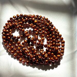 Pearl necklace: copper colored baroque pearls with matching bracelet.